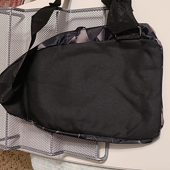 Small Sling Backpack/ Crossbody bag NWOT w/ headphone jack - Picture 2 of 5